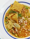 Top View Noodles In Thai Spicy Tom Yum Soup With Pork