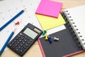 Top view notebook ,calculator,pencil,post it note and calendar p