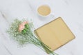notebook with empty vintage paper sheets ,coffee with milk cup and flowers Royalty Free Stock Photo