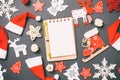Top view of notebook. New Year decorations on black background. Merry Christmas concept Royalty Free Stock Photo