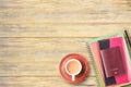 Top view of notebook,passport,pencil and cup of coffee on office