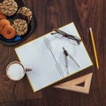 Top view of notebook, stationery, drawing tools and a few cups coffee. Royalty Free Stock Photo