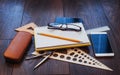 Top view of notebook, stationery, drawing tools and a few glasses. improvise. Royalty Free Stock Photo