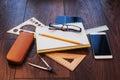 Top view of notebook, stationery, drawing tools and a few glasses. improvise. Royalty Free Stock Photo