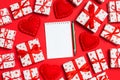 Top view of notebook, white gift boxes and red textile hearts on colorful background. Valentine`s Day concept Royalty Free Stock Photo