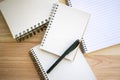 Paper notebooks collection and black writing pen Royalty Free Stock Photo