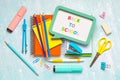 Top view of notebooks and school supplies with speech bubble with the text Back to school. Back to school concept Royalty Free Stock Photo