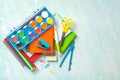 Top view of notebooks,school supplies and watercolors with space for text. Back to school concept Royalty Free Stock Photo