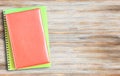 Top view notebooks on wood table background