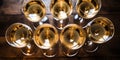 Top view of numerous champagne glasses. AI generative