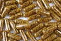 Top view of nutritional supplement capsules with bee pollen inside close up. Royalty Free Stock Photo