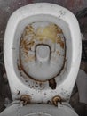 top view oÃÂ° crap Restroom in abandoned building. unwashed toilet white bowl ceramic full of urine. Old dirty toilet. water