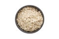 A top view of oat flakes in a ceramic bowl on white background Royalty Free Stock Photo