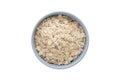 A top view of oat flakes in a ceramic bowl on white background Royalty Free Stock Photo