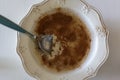 Top view of Oatmeal with cinnamon in a vintage bowl and a spoon Royalty Free Stock Photo