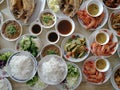 Top View of Offer food to the monk, Rice vermicelli with minced fishes and coconut milk in red curry , Barbecued shrimp , Stir Fr