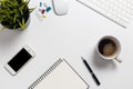 Top view office desk with computer and office supplies.Coffee, telephone on white table Royalty Free Stock Photo