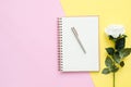 Top view office desk with open mock up notebooks and pencil and plant on pink yellow pastel color background. Royalty Free Stock Photo