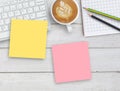 Top view office desk with pink and yellow sticky note Royalty Free Stock Photo