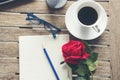 Top view office desk smart tablet document paper, coffee cup roses on wood table with copy space. Tabletop notebook office empty Royalty Free Stock Photo