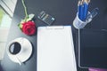Top view office desk smart tablet document paper, coffee cup roses on wood table with copy space. Tabletop notebook office empty Royalty Free Stock Photo