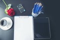 Top view office desk smart tablet document paper, coffee cup roses on wood table with copy space. Tabletop notebook office empty Royalty Free Stock Photo