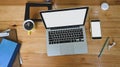 Top view office desk is surrounding by a white blank screen computer laptop and accessories Royalty Free Stock Photo