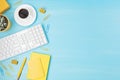 Top view of office desk. Table with keyboard, smartphone, clipboard and office supplies. Flat lay home office workspace, remote