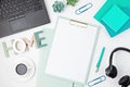 Top view of office desk. Table with laptop, conference speakerphone and office supplies. Flat lay home office workspace, remote Royalty Free Stock Photo