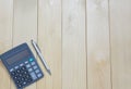 Top view office table calculator with pen on the table