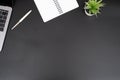 Top view office table desk on black background Royalty Free Stock Photo