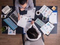 Top view of office workers meeting analyzing financial charts Royalty Free Stock Photo