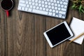 Top view. Office workplace table with keyboard, coffee cup, tablet, supplies, Flat lay Royalty Free Stock Photo