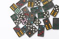 Top view old black color dominoes with colorful dot pieces on white floor background.