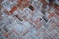 Top view of old bricks paving stones footpath pattern on sidewalk outdoors as brickwork weave texture or abstract stone paver Royalty Free Stock Photo