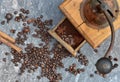 old coffee grinder full of coffee and beans with spices on grey marble bacground Royalty Free Stock Photo