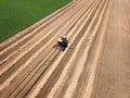 Top view of old harvester reaps grain Royalty Free Stock Photo