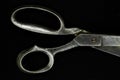 Top view of old metal scissors handle isolated on black background Royalty Free Stock Photo