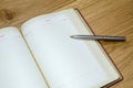 Top view of old open book with fountain pen Royalty Free Stock Photo