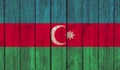 Top view of Old Painted Flag of Azerbaijan on Dark Wooden Fence, wall. patriot and travel concept. no flagpole. Flag background.