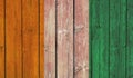 Top view of Old Painted Flag of Cote d\'lvoire on Dark Wooden Fence, wall. patriot and travel concept. no flagpole.