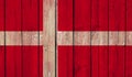 Top view of Old Painted Flag of denmark on Dark Wooden Fence, wall. patriot and travel concept. no flagpole. Flag background. Royalty Free Stock Photo