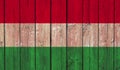 Top view of Old Painted Flag of Hungary on Dark Wooden Fence, wall. patriot and travel concept. no flagpole. Flag background. Royalty Free Stock Photo