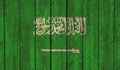 Top view of Old Painted Flag of Saudi Arabia on Dark Wooden Fence, wall. patriot and travel concept. no flagpole. Flag background Royalty Free Stock Photo