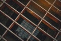 Top view of old and rusty metal covered on street drain hose. Rust metal texture background. Salt water accelerates rust. Surface Royalty Free Stock Photo