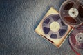 Top view of old sound recording tape, reel to reel type and box. Royalty Free Stock Photo