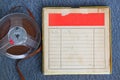 Top view of old sound recording tape, reel to reel type and box with room for text. filtered image Royalty Free Stock Photo