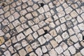 Top view of an old stone paved street.Cobblestone road pavement texture.White tone stone walkway abstract background. Royalty Free Stock Photo