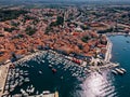 Top view of the old town of Rovinj, seaport, houses with red roofs and the sea, Croatia. The tiled roofs of the old city