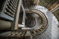 Top view of old vintage decorated spiral staircase in abandoned mansion Royalty Free Stock Photo